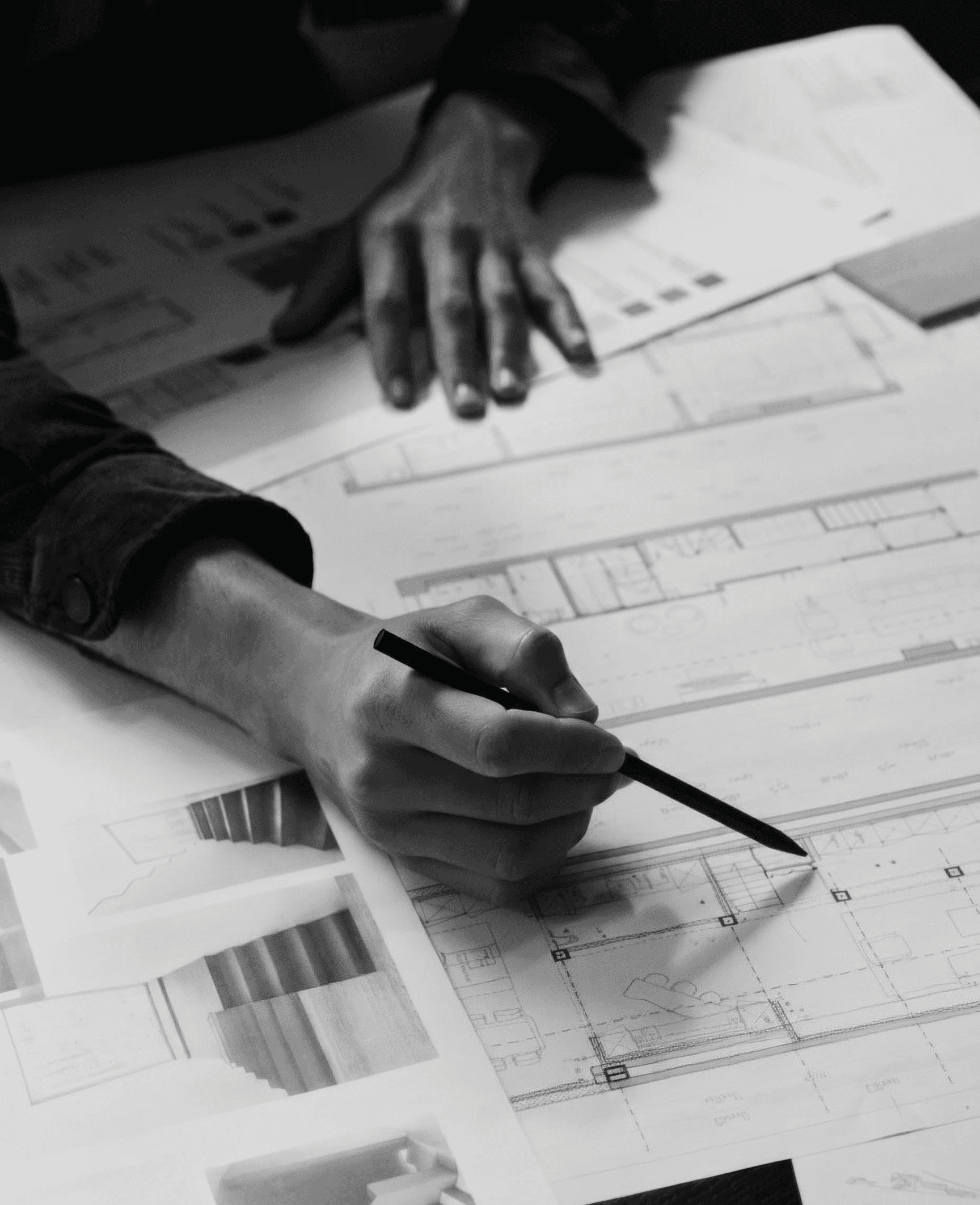 Hand drawing on architectural blueprints